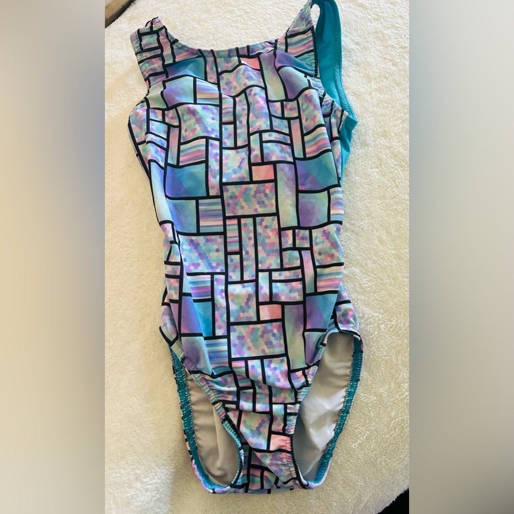 Girls size child small leotard with open back. Fits normally as stated size.
